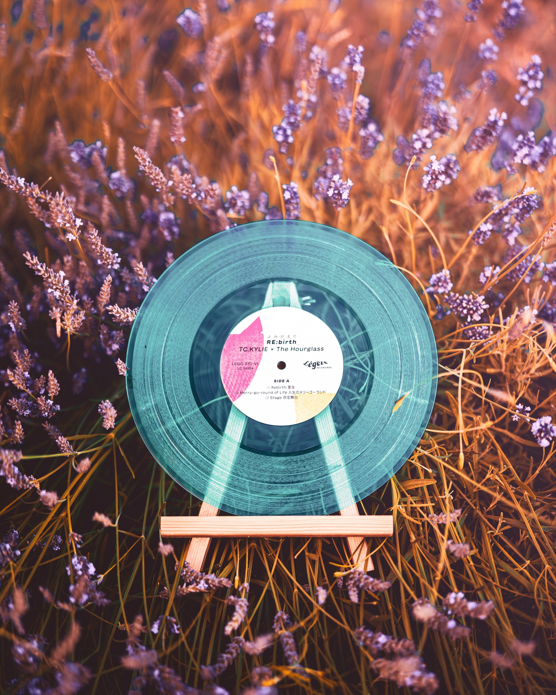 RE:birth transparent sky-blue vinyl displayed among lavender
